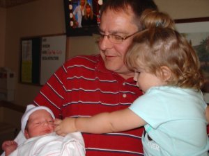 Papaw with both grandbaby girls.